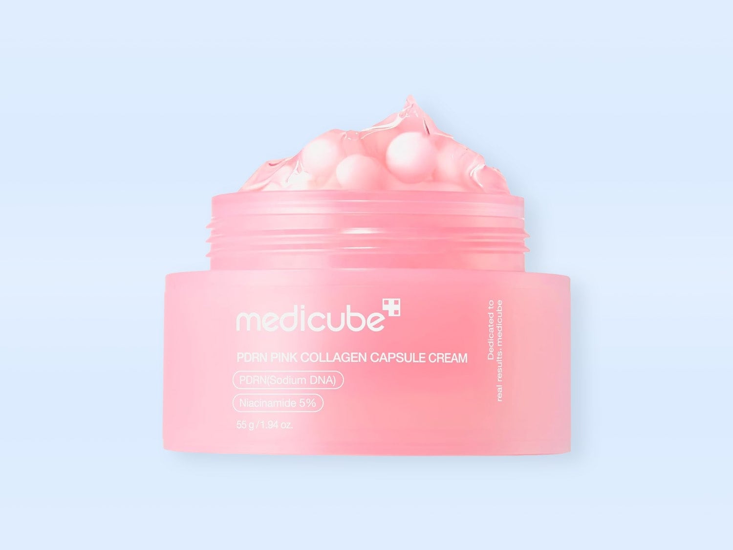 Crema Medicube PDRN Pink Collagen Capsule, într-un recipient roz deschis, cu o textură bogată, roz, cu capsule mici, albe, vizibile, oferă 55g/1.94 oz de hidratare intensă cu PDRN (ADN de sodiu) și 5% Niacinamidă.