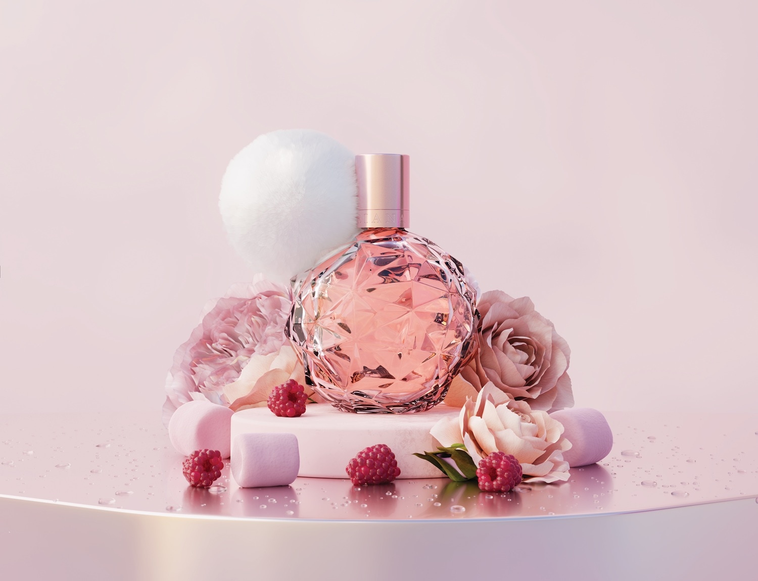 A pink, faceted perfume bottle with a gold cap and a white fluffy pom-pom sits on a white pedestal, surrounded by pink roses, raspberries, and pink marshmallows, all on a reflective surface with water droplets.
