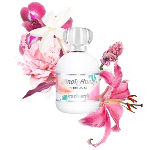 Biała butelka perfum Cacharel Anais Anais L'Original otoczona różowymi i białymi kwiatami.