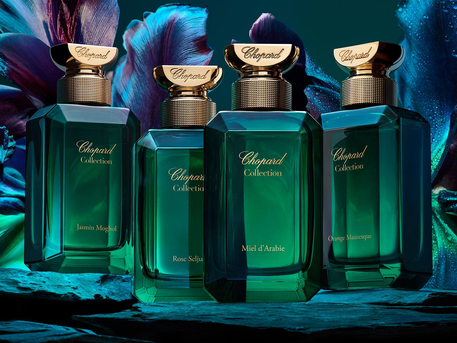 Cztery flakony Chopard Collection w odcieniach zieleni i złota, każdy z nazwą zapachu: Jasmin Moghol, Rose Selju, Miel d'Arabie i Orange Mauresque.