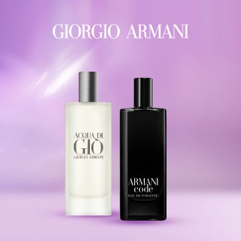 Dwa flakony perfum Giorgio Armani: Acqua di Giò o jasnej zawartości i srebrnej nakrętce oraz Armani Code w czarnym flakonie.
