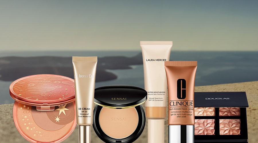 Collection of beauty products including Clarins bronzer with star design, Dr Irena Eris BB cream SPF 50, Sensai face powder, Laura Mercier tinted moisturizer SPF 30, Clinique sun-kissed face gelee, and Douglas highlighter palette.