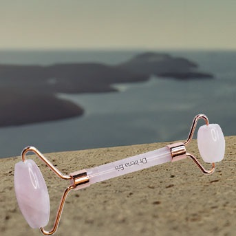 Różowy roller do masażu twarzy Dr Irena Eris z dwoma wałeczkami, idealny do pielęgnacji skóry i relaksu.