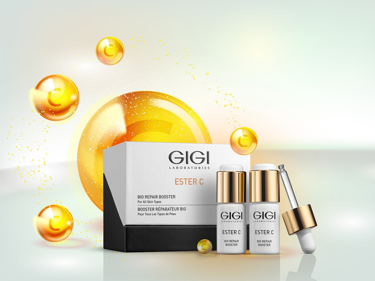 Pudełko i butelki GIGI Laboratories Ester C Bio Repair Booster do pielęgnacji skóry, z serum i złotymi akcentami.
