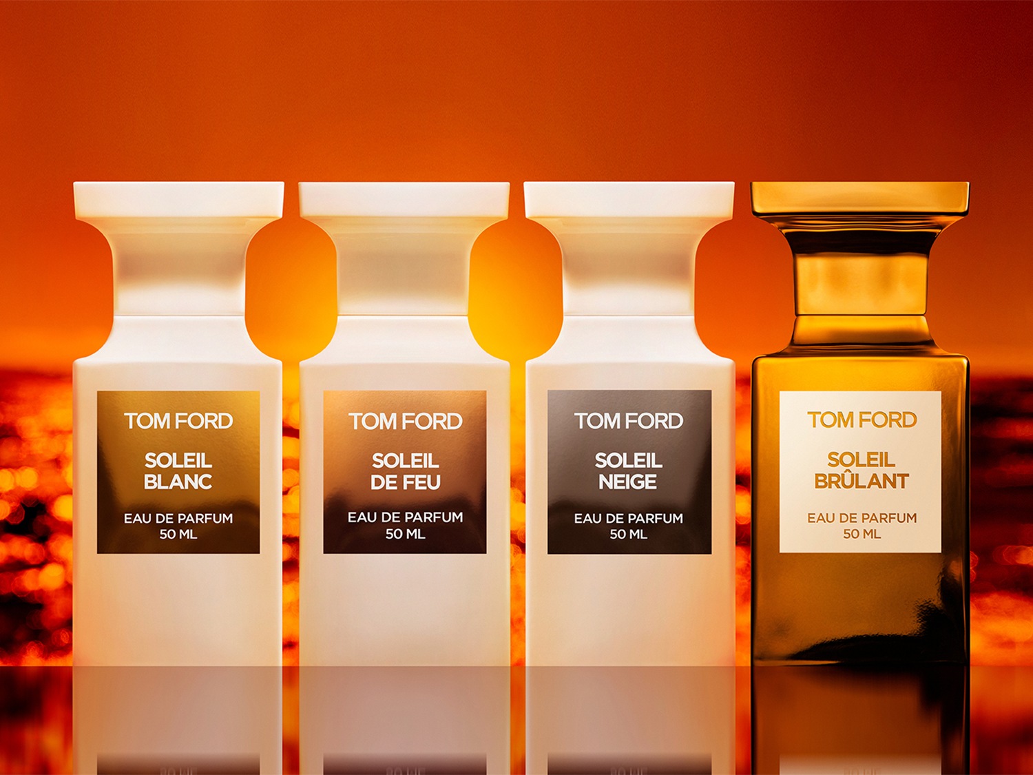 Vierkante flessen Tom Ford Soleil Eau de Parfum in wit en goud, elk 50 ml, met de namen Blanc, de Feu, Neige en Brûlant.