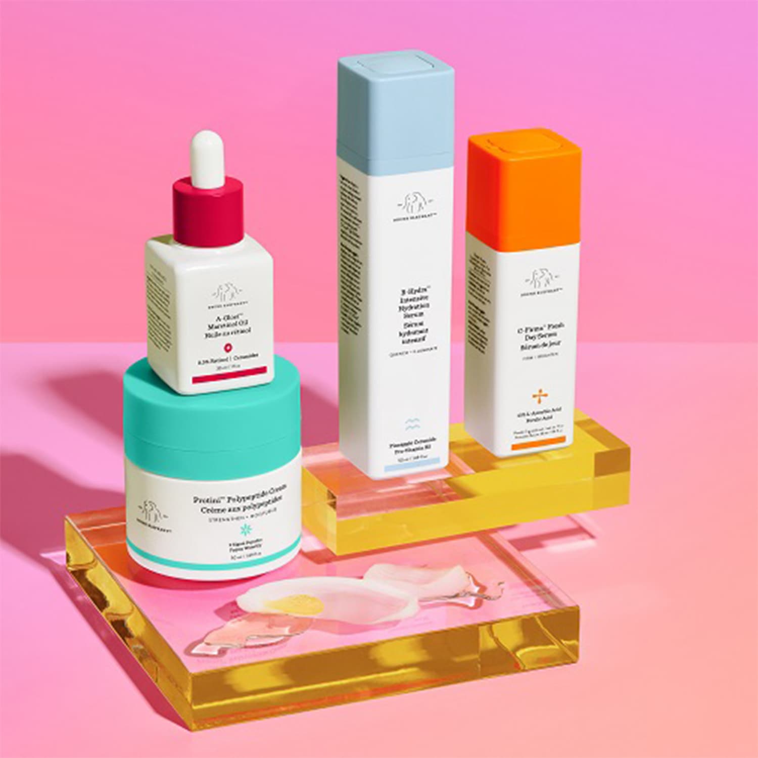 Entdecken Sie die Drunk Elephant Kollektion: A-Gloei Öl, Protini Creme, B-Hydra Serum und C-Firma Serum für strahlende Haut.
