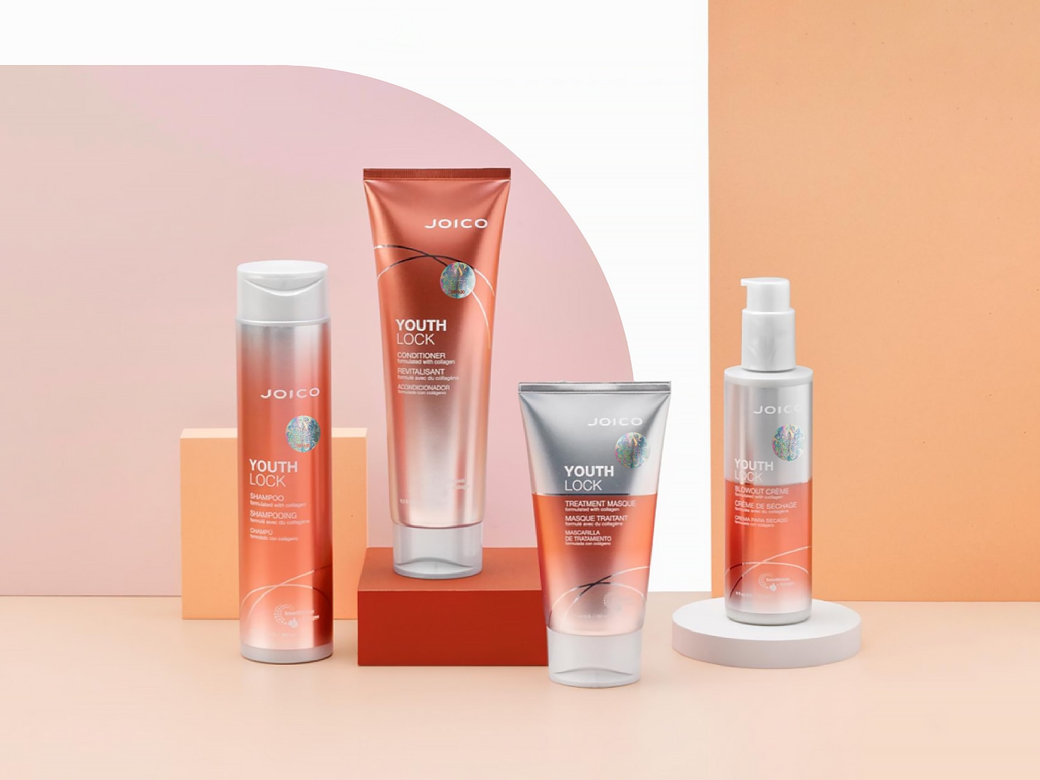 Zestaw kosmetyków Joico Youth Lock do włosów, w skład którego wchodzą szampon, odżywka, maska i krem do modelowania, wszystkie w odcieniach miedzi i srebra.