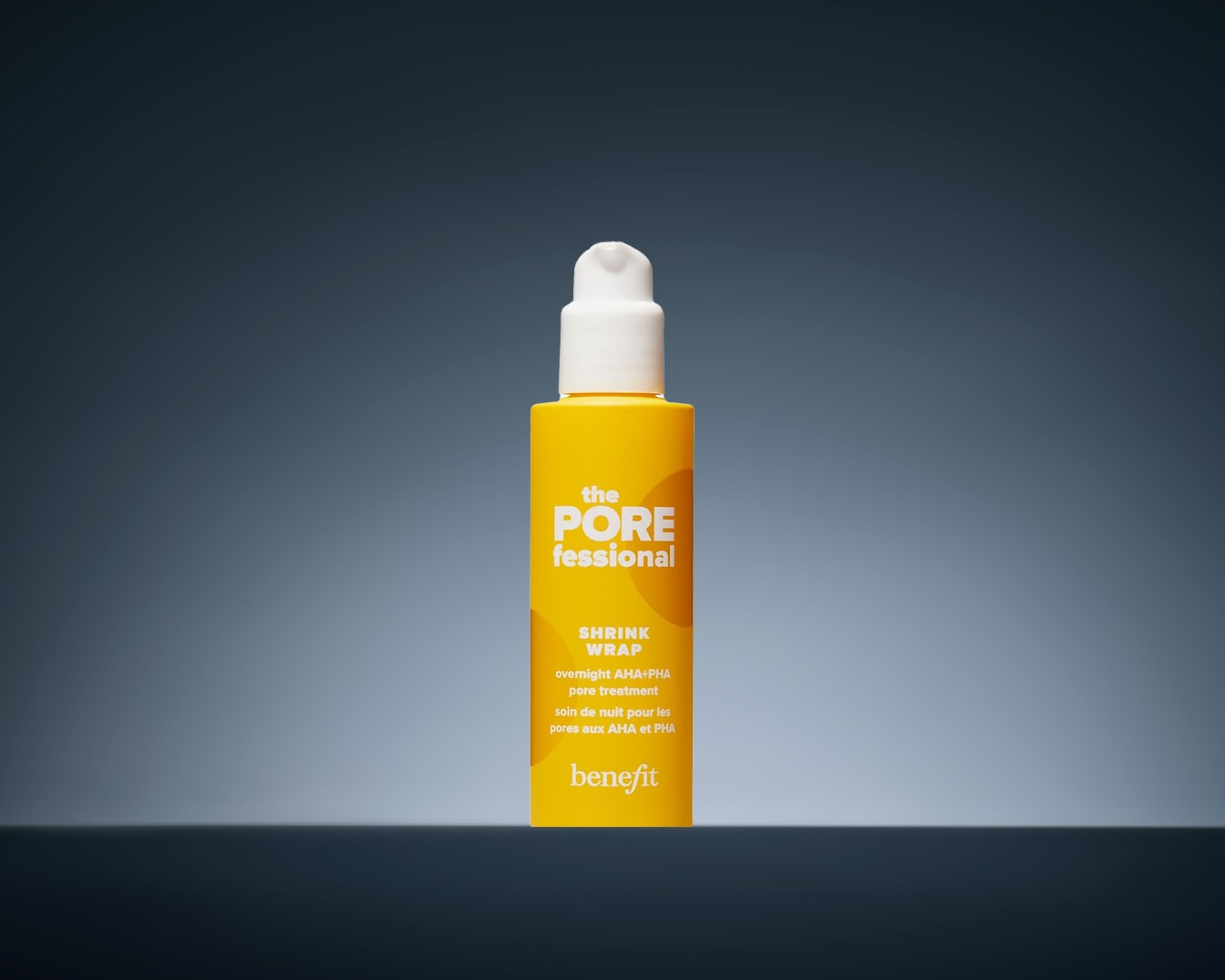 This is a yellow bottle of Benefit's The POREfessional Shrink Wrap overnight AHA+PHA pore treatment, designed to refine pores while you sleep.