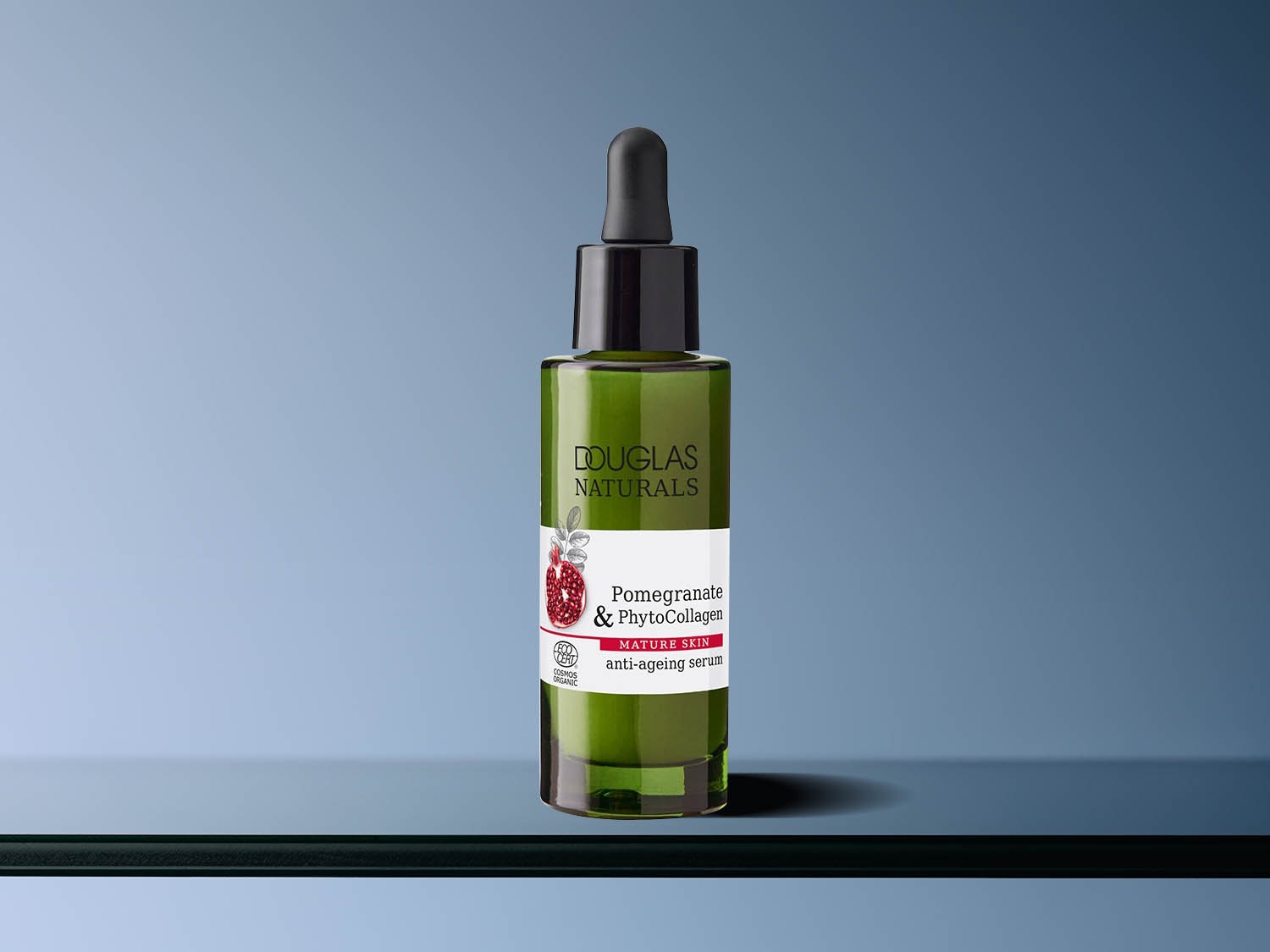 Butelka zielonego serum Douglas Naturals Pomegranate & PhytoCollagen do cery dojrzałej, z pipetą, na etykiecie napis Pomegranate & PhytoCollagen, przeciwstarzeniowe serum.
