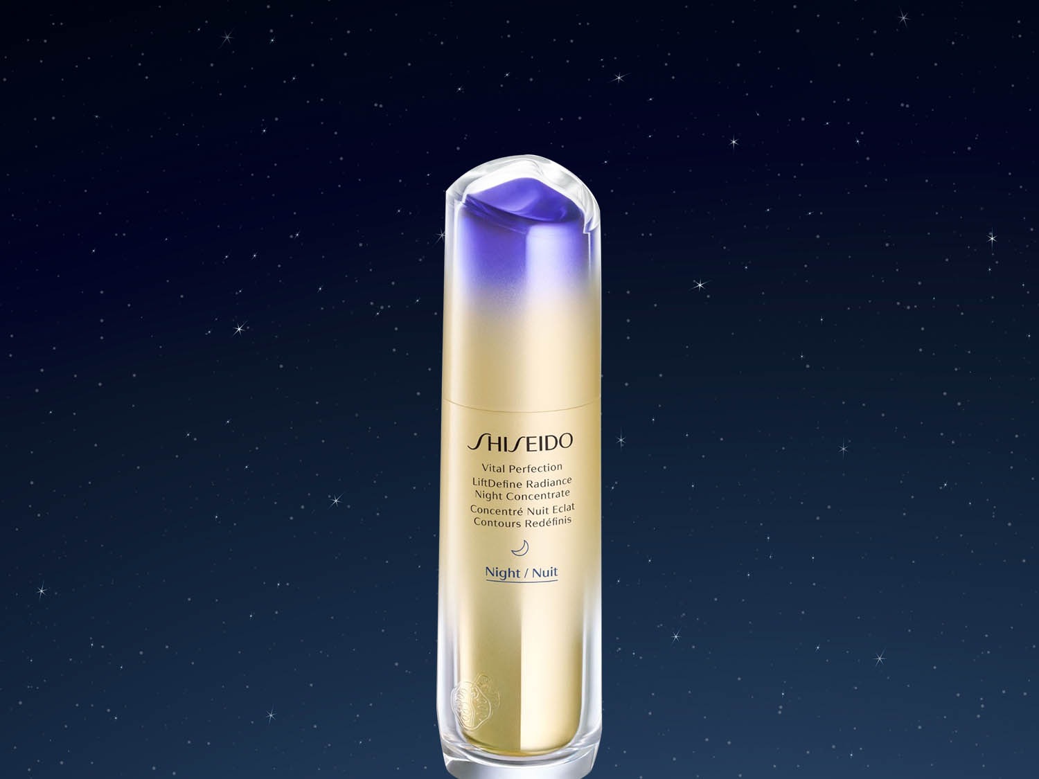 Butelka Shiseido Vital Perfection LiftDefine Radiance Night Concentrate z gradientem od fioletu do złota na tle nocnego nieba.