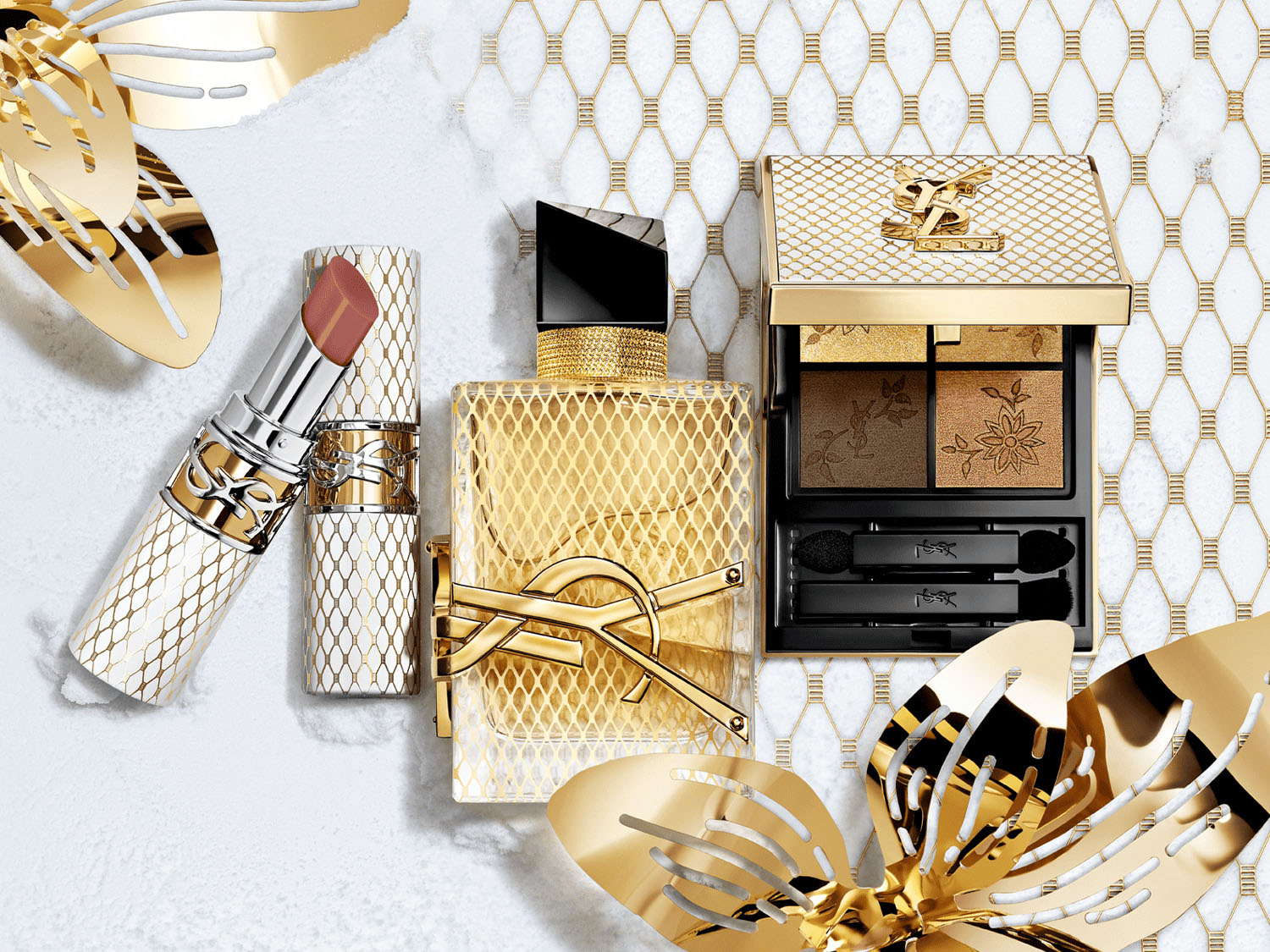 Kolekcja YSL w odcieniach złota obejmuje szminkę, perfumy i paletę cieni do powiek, idealne do stworzenia luksusowego wyglądu.