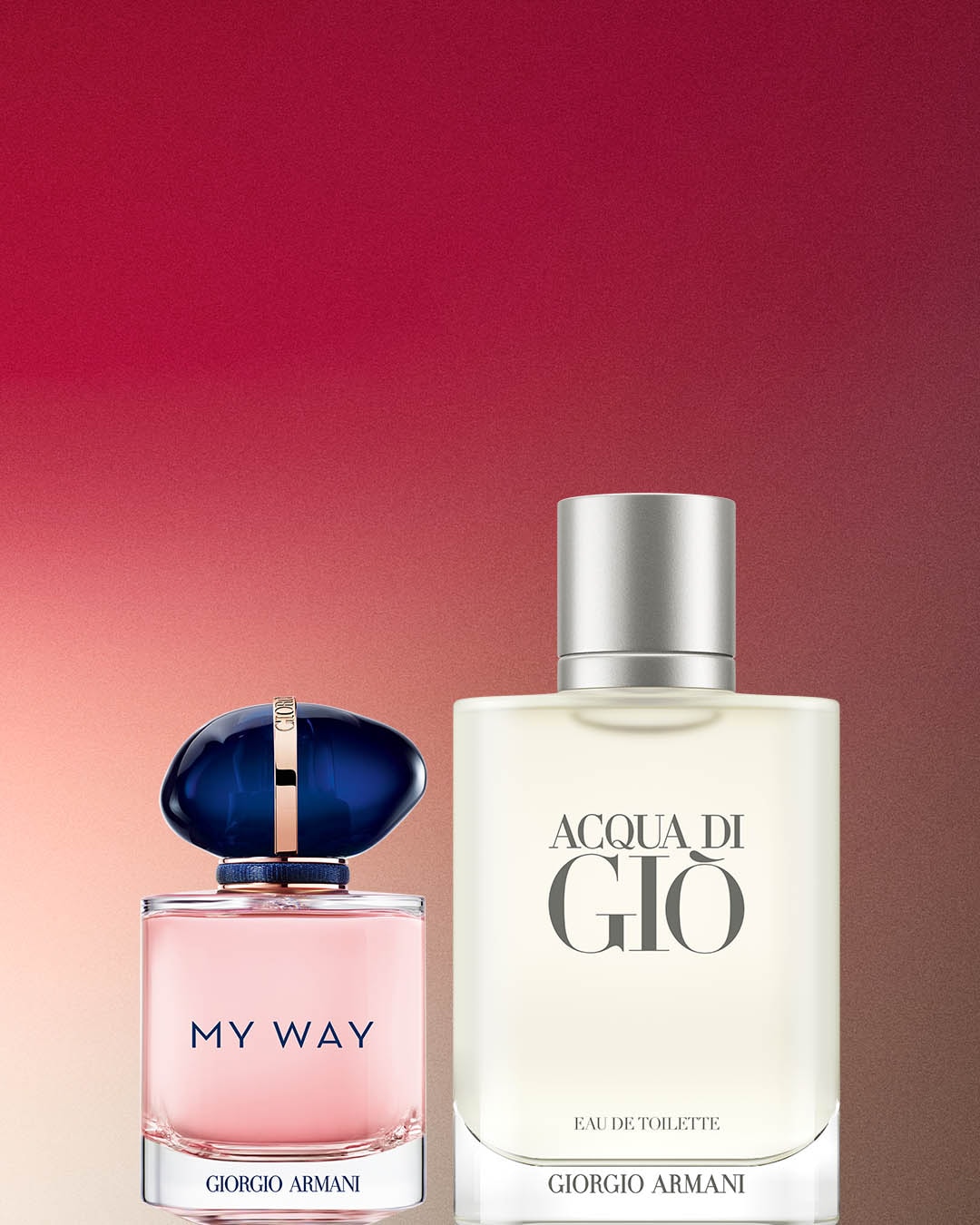 Dwa flakony perfum Giorgio Armani: „My Way” w różowym flakonie z granatowym korkiem i „Acqua di Giò” w przezroczystym flakonie z szarym korkiem.