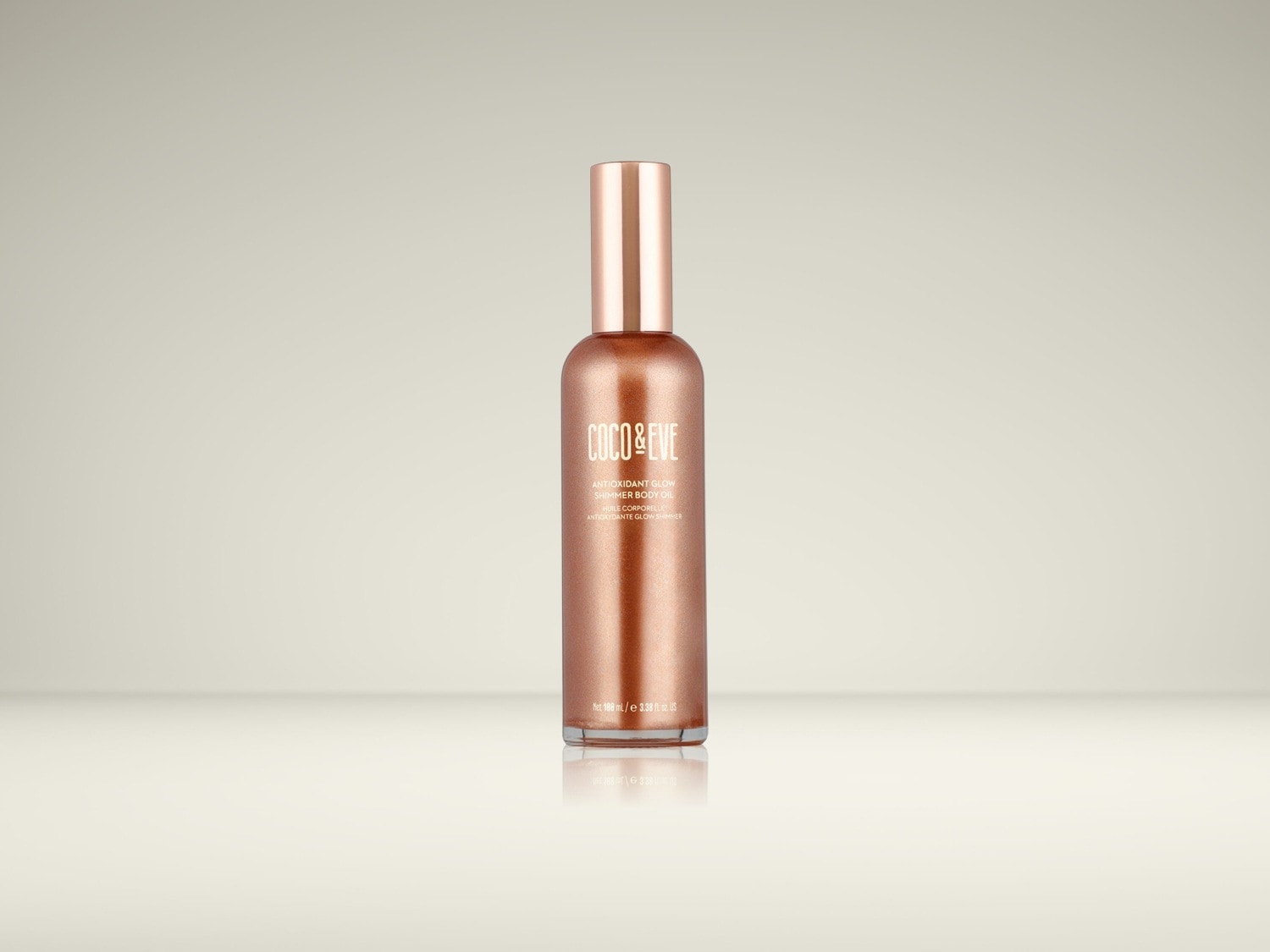 De Coco & Eve Antioxidant Glow Shimmer Body Oil in een glanzende koperkleurige fles van 100 ml, perfect voor een stralende huid.