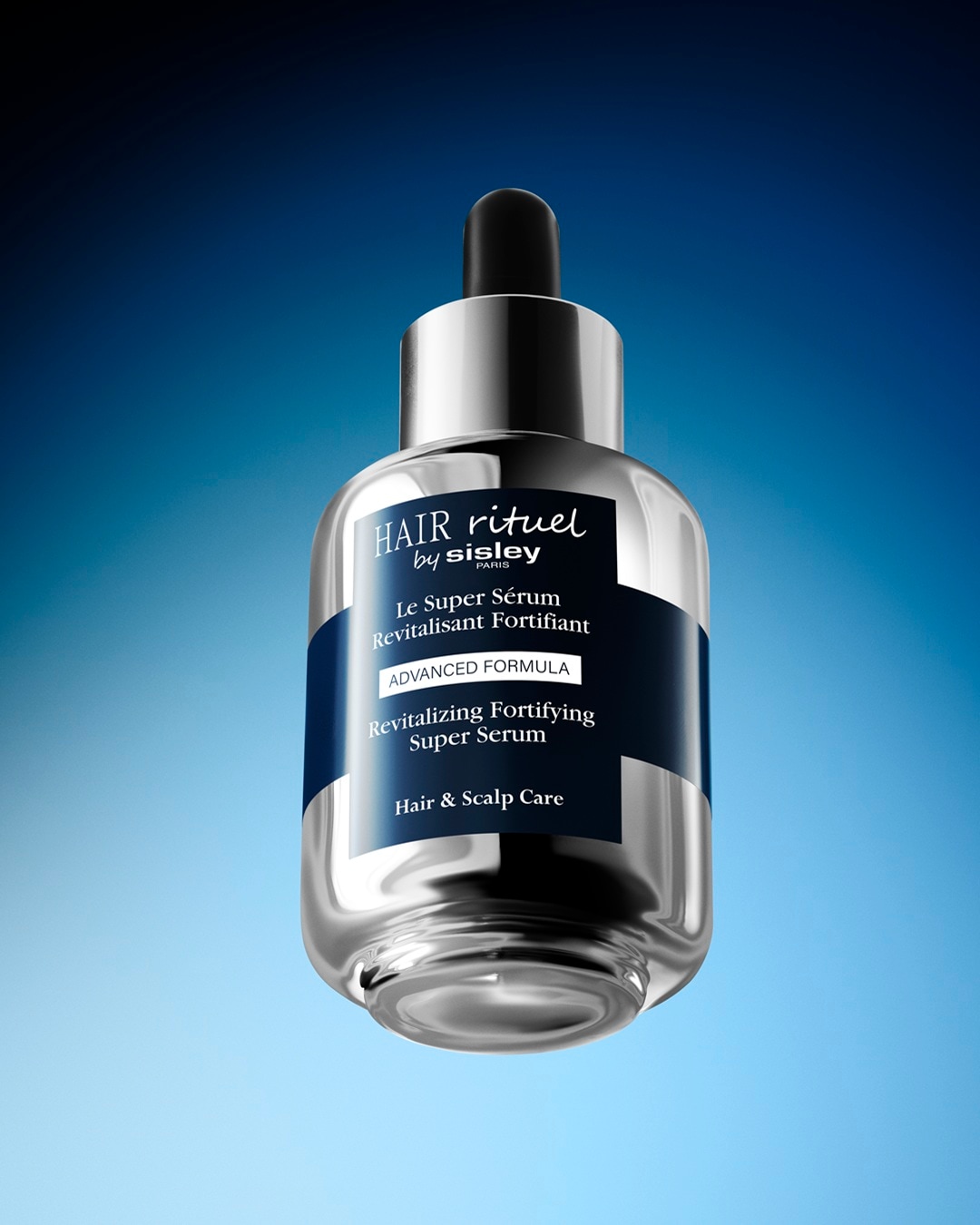 Hair Rituel by Sisley Le Super Sérum Revitalisant Fortifiant to zaawansowana formuła rewitalizującego i wzmacniającego serum do włosów i skóry głowy, w eleganckiej butelce z pipetą.