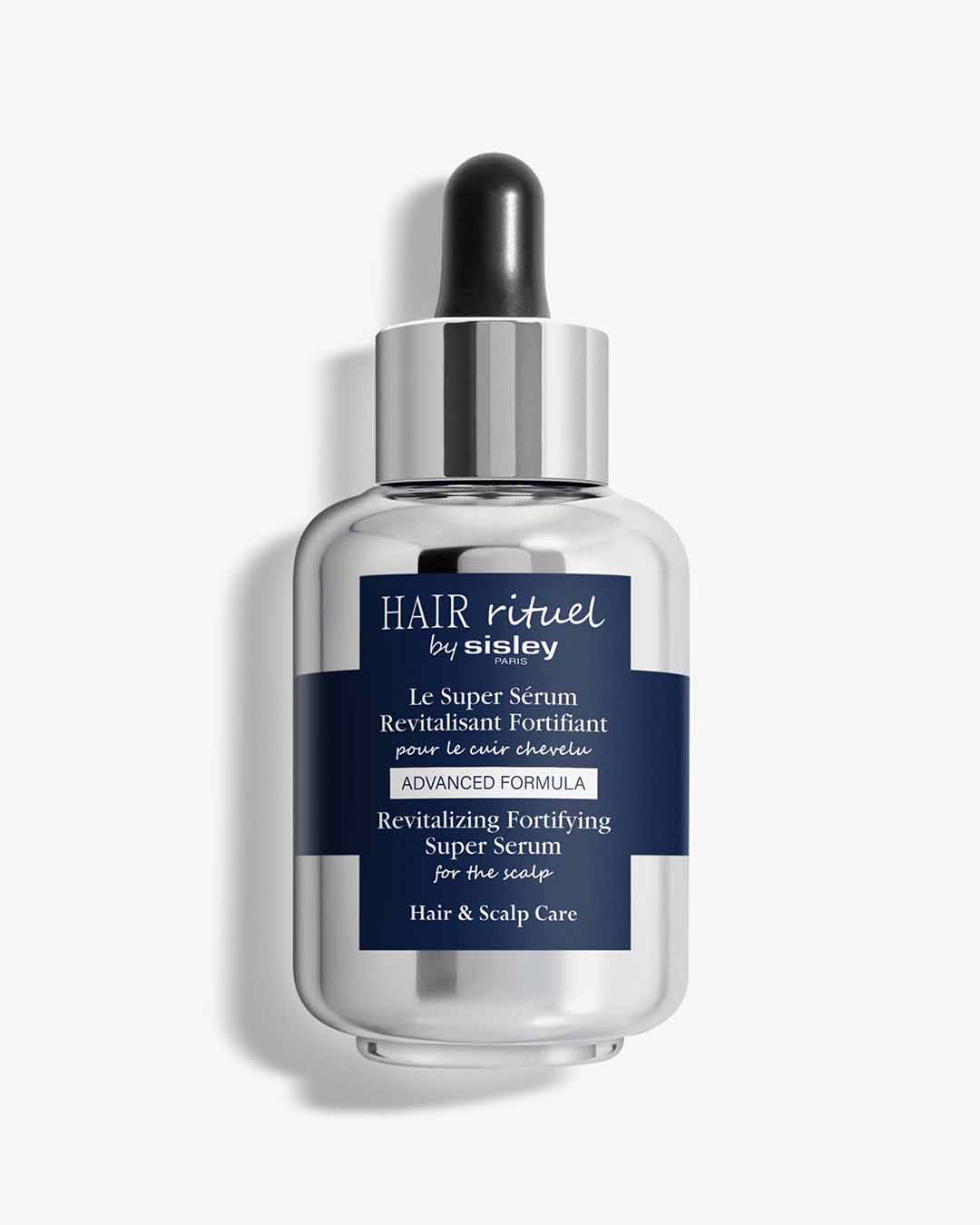 Le sérum capillaire Hair Rituel by Sisley, présenté dans un flacon en verre argenté avec un compte-gouttes noir, est un sérum revitalisant et fortifiant pour le cuir chevelu.