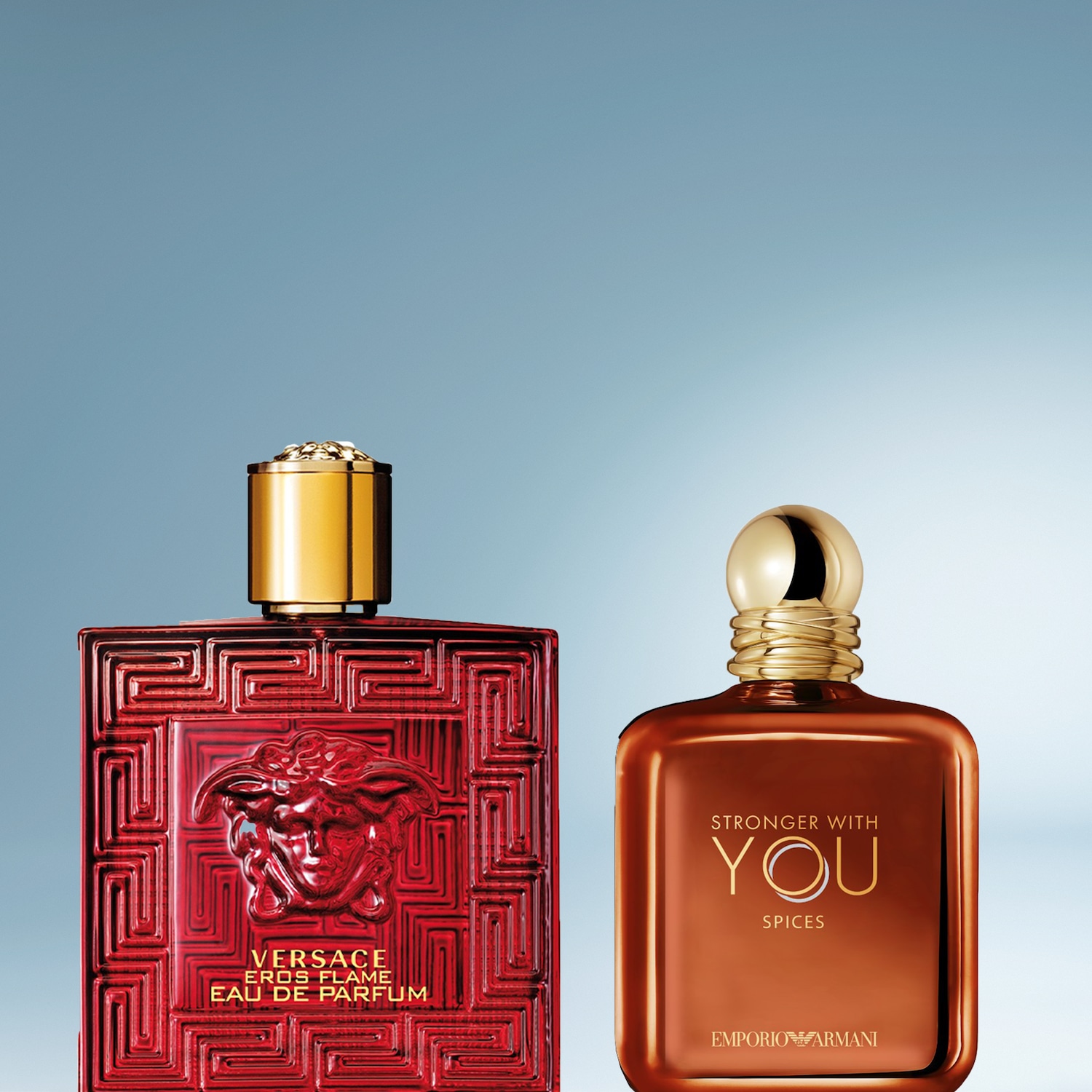 De Versace Eros Flame Eau de Parfum, een rode, rechthoekige fles met een gouden dop en een Medusa-hoofd reliëf, staat naast de Emporio Armani Stronger With You Spices, een bruine, rechthoekige fles met een gouden dop.